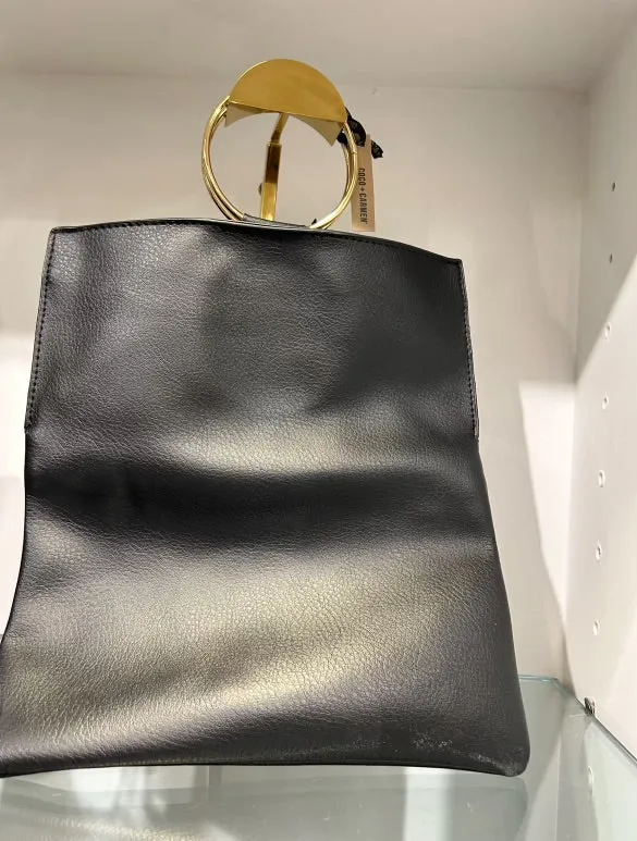 Black folding clutch with gold hoop straps